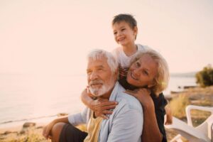 Grandparents playing with their grandson on Hilton Head beach.